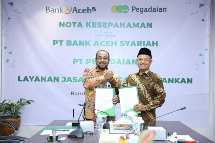Penandatanganan MoU ini dilakukan oleh Plt. Direktur Utama Bank Aceh, Fadhil Ilyas, dan Chief of Transformation Office PT Pegadaian, Mulyono di Bank Aceh Kantor Pusat Banda Aceh, 17 Juli 2024. FOTO/Dok. BAS untuk HARIANACEH.co.id. Ⓒ Hak cipta foto di atas dikembalikan sesungguhnya kepada pemilik foto