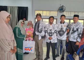 PGRI Kabupaten Aceh Besar menyerahkan 100 paket Ramadhan untuk guru pada Rabu (19/3/2025) di sekretariat PGRI Aceh Besar, Bada Ingin Jaya. FOTO/Net. Ⓒ Hak cipta foto di atas dikembalikan sesungguhnya kepada pemilik foto