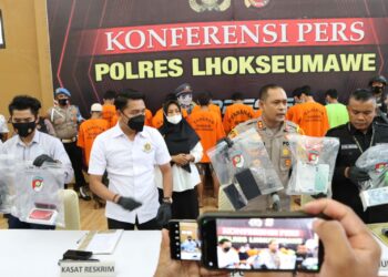 Kapolres Lhokseumawe, AKBP Henki Ismanto dalam konferensi pers di Gedung Serbaguna Mapolres Lhokseumawe, Rabu (20/7/2022). FOTO/Dok. Istimewa
